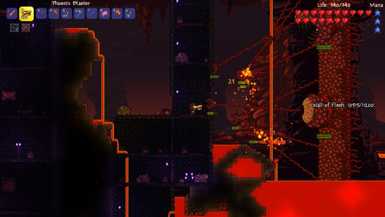 Terraria boss fight against the Wall of Flesh in the underworld